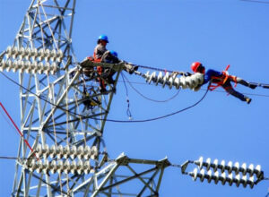 What is the role of electric cable insulators, which are indispensable during cable erection?