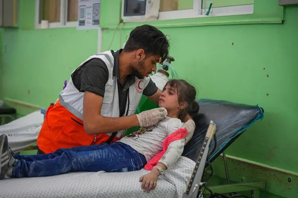 At a local hospital in Gaza, patients who have been bombed are being transferred.