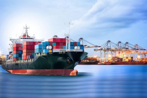 Cable reels prepared for ocean freight with moisture-proof wrapping and secure stacking